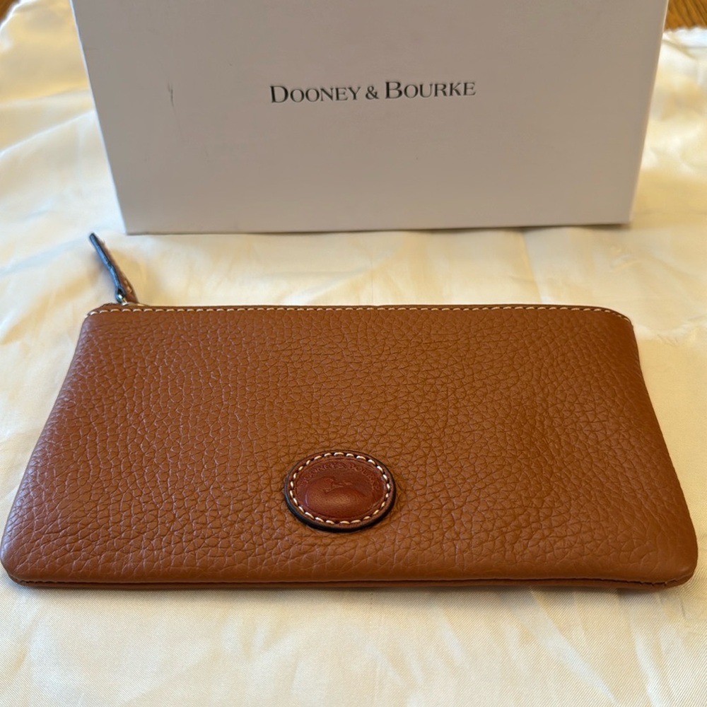NWOT Dooney and Bourke Clutch/wallet NEW no tags.